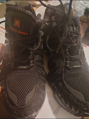 Nike Black Men’s Shox Athletic Sneakers with Orange Logo Accents